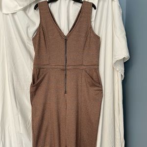 Sleeveless Juniors-fit plaid jumpsuit with front zipper.